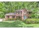 Charming brick two-story home featuring manicured landscaping, a lush green lawn, and a welcoming front entrance at 4259 Arbor Club Dr, Marietta, GA 30066