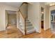 Hallway featuring hardwood floors and staircase at 4259 Arbor Club Dr, Marietta, GA 30066