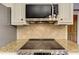 Close up of range and overhead microwave at 4259 Arbor Club Dr, Marietta, GA 30066