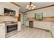 Bright kitchen with stainless steel appliances and granite countertops at 4259 Arbor Club Dr, Marietta, GA 30066