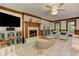Living room featuring a brick fireplace, TV, and an inviting sitting area at 4259 Arbor Club Dr, Marietta, GA 30066