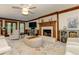 Bright living room boasts a brick fireplace, neutral furniture, and a patterned rug at 4259 Arbor Club Dr, Marietta, GA 30066