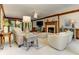 Cozy living room features a brick fireplace, neutral furniture, and a ceiling fan at 4259 Arbor Club Dr, Marietta, GA 30066