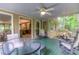 Relaxing screened patio with ceiling fan, comfortable seating, and views to the indoor living space at 4259 Arbor Club Dr, Marietta, GA 30066