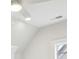 Bright attic space with a fan and window at 105 Cumming St, Alpharetta, GA 30009