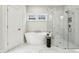 Elegant bathroom with a freestanding tub, glass-enclosed shower, and modern finishes at 105 Cumming St, Alpharetta, GA 30009