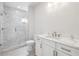 Bright bathroom featuring a sleek glass shower, modern vanity, and stylish tile work at 105 Cumming St, Alpharetta, GA 30009