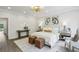 Inviting bedroom featuring a comfortable bed, stylish decor, and a view of the outdoors at 105 Cumming St, Alpharetta, GA 30009