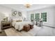 Beautiful bedroom with a sitting area, natural light, and neutral color palette at 105 Cumming St, Alpharetta, GA 30009