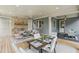 Inviting covered patio with brick fireplace and outdoor dining set at 105 Cumming St, Alpharetta, GA 30009