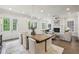 Open-concept dining area featuring hardwood floors and seamless integration with the living space at 105 Cumming St, Alpharetta, GA 30009