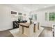 Elegant dining room with hardwood floors, stylish light fixture, and sophisticated decor at 105 Cumming St, Alpharetta, GA 30009