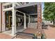 Stylish Fogon & Lions exterior with modern pergola and brick accents for outdoor dining at 105 Cumming St, Alpharetta, GA 30009