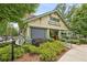 Charming Hen Mother Cookhouse exterior with craftsman details and lush landscaping at 105 Cumming St, Alpharetta, GA 30009
