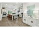 Modern kitchen with white cabinetry, stainless steel appliances, large island, and stylish decor at 105 Cumming St, Alpharetta, GA 30009