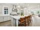 Elegant kitchen featuring a center island, stainless steel range hood, and pendant lighting at 105 Cumming St, Alpharetta, GA 30009