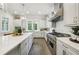 Spacious kitchen with a large island, quartz countertops, and stainless steel appliances at 105 Cumming St, Alpharetta, GA 30009