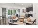 Inviting living area with access to a covered patio, featuring a wet bar and comfortable seating at 105 Cumming St, Alpharetta, GA 30009