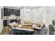 Comfortable living area with navy cabinets, wet bar, mini fridge, and seating area at 105 Cumming St, Alpharetta, GA 30009
