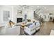 Bright living room with fireplace, hardwood floors, and stylish modern furnishings at 105 Cumming St, Alpharetta, GA 30009