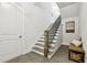 Hall with staircase featuring hardwood floors, bench seat and modern railings at 105 Cumming St, Alpharetta, GA 30009