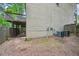 The backyard view with a deck and a partial side of the house, and has a wooden fence at 1636 Caswell Pkwy, Marietta, GA 30060
