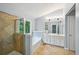Bathroom featuring double vanity sinks, separate shower, and a bathtub under a window at 1636 Caswell Pkwy, Marietta, GA 30060