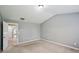 Spacious bedroom with carpeted floors, light colored walls, and vaulted ceilings at 1636 Caswell Pkwy, Marietta, GA 30060