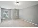 Bedroom featuring gray walls, carpeted floors and two windows at 1636 Caswell Pkwy, Marietta, GA 30060