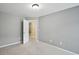 Bedroom featuring gray walls, carpeted floors, and a white door at 1636 Caswell Pkwy, Marietta, GA 30060