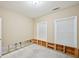 An empty bedroom with exposed framing and two windows for natural light at 1636 Caswell Pkwy, Marietta, GA 30060