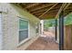 An exterior view showing the side of the brick house with access to under deck at 1636 Caswell Pkwy, Marietta, GA 30060
