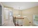 Hallway with doors leading to rooms and carpeted floors on the second story of the house at 1636 Caswell Pkwy, Marietta, GA 30060