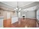 Open living space with hardwood floors, fireplace, and seamless transition to other rooms in the home at 1636 Caswell Pkwy, Marietta, GA 30060