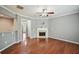 Inviting living room featuring hardwood floors, a cozy fireplace, and neutral color scheme at 1636 Caswell Pkwy, Marietta, GA 30060