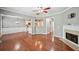 Open-concept living room boasts hardwood floors, fireplace, and seamless flow into the dining area and kitchen at 1636 Caswell Pkwy, Marietta, GA 30060