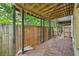 A partially covered outdoor patio area with a wooden fence and support beams at 1636 Caswell Pkwy, Marietta, GA 30060