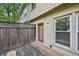 Cozy outdoor patio with wood fence and access to the home at 1636 Caswell Pkwy, Marietta, GA 30060