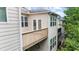 Private balcony off the townhome provides an intimate outdoor escape and architectural interest at 2988 Rivergreen Se Ln, Atlanta, GA 30339