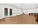 Spacious basement featuring sliding glass doors to the backyard and modern flooring at 2988 Rivergreen Se Ln, Atlanta, GA 30339