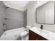 Bathroom features shower-tub combo with tile and a vanity with a dark wood cabinet at 2988 Rivergreen Se Ln, Atlanta, GA 30339