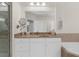 Bright bathroom features a large vanity with a countertop, mirror, and updated fixtures at 2988 Rivergreen Se Ln, Atlanta, GA 30339
