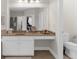 Bright bathroom offers a vanity with counter space, and storage with a large mirror at 2988 Rivergreen Se Ln, Atlanta, GA 30339