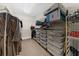 Walk-in closet with built-in shelving and hanging rods for optimal organization at 2988 Rivergreen Se Ln, Atlanta, GA 30339