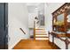 Bright entryway features hardwood floors, staircase, and decorative mirror at 2988 Rivergreen Se Ln, Atlanta, GA 30339