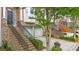 Brick townhome with black wrought iron railing leading to the front door and two car garage at 2988 Rivergreen Se Ln, Atlanta, GA 30339