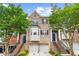 Charming brick townhome with two-car garage and landscaped front yard at 2988 Rivergreen Se Ln, Atlanta, GA 30339