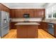 Kitchen with stainless steel appliances and a center island with granite countertops at 2988 Rivergreen Se Ln, Atlanta, GA 30339