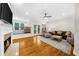 Cozy living room with fireplace, hardwood floors, and plush seating at 2988 Rivergreen Se Ln, Atlanta, GA 30339