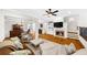 Spacious living area with fireplace, built-in shelving, and hardwood floors at 2988 Rivergreen Se Ln, Atlanta, GA 30339